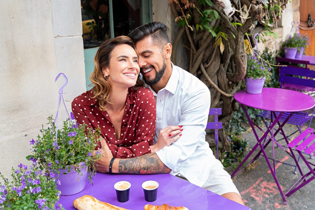 Super-cute Paris engagement photo with couple enjoying a cafe at Au Vieux Paris Arcole
