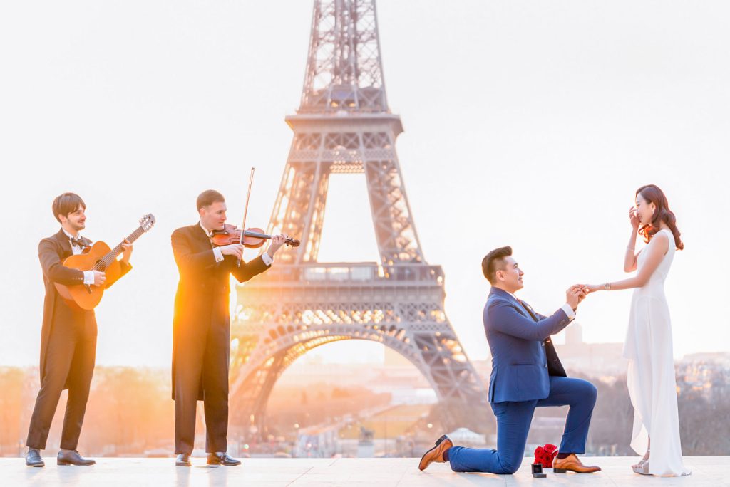 Epic Eiffel Tower engagement at Trocadero at sunrise with musicians
