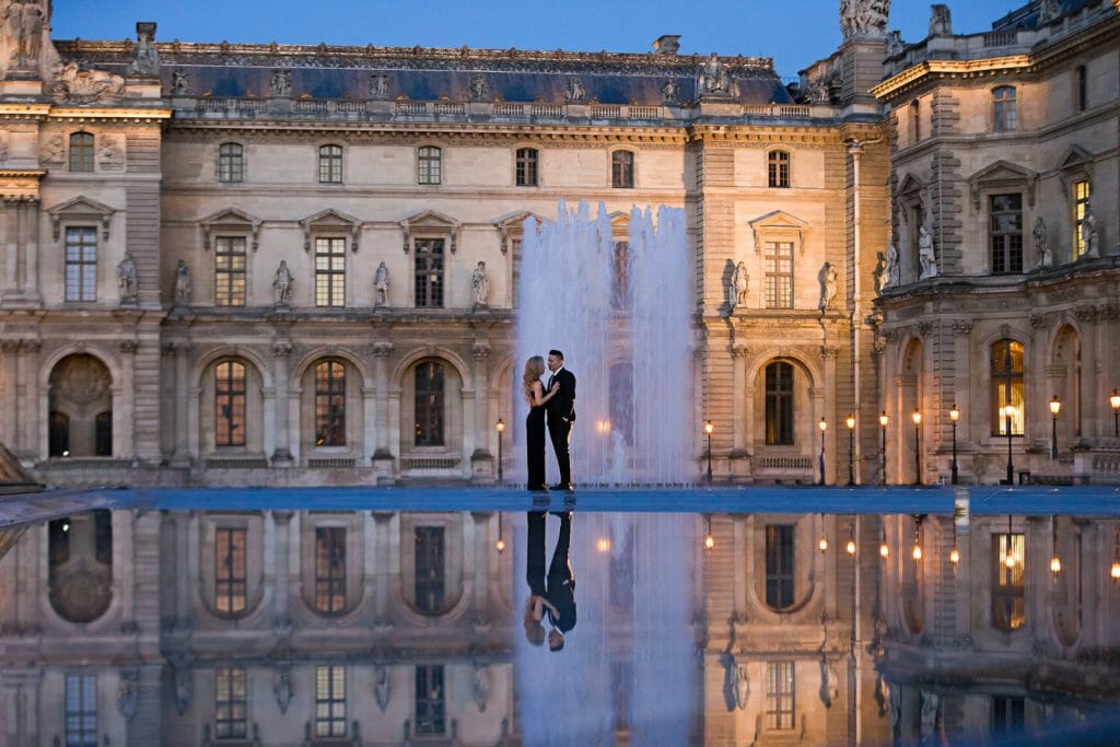 Creative nighttime couple photoshoot at the Louvre Museum