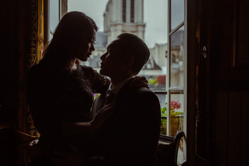 Romantic couple photography ideas at Au Vieux Paris d’Arcole Cafe near Notre Dame