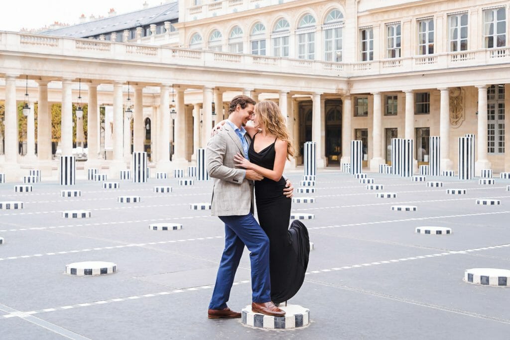 Fun and playful Paris engagement photos at Palais Royal Buren Columns