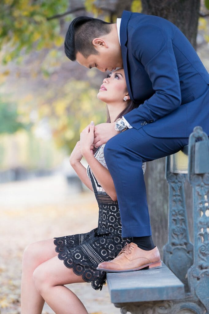 Romantic couple photoshoot in Paris Tuileries Garden on a bench