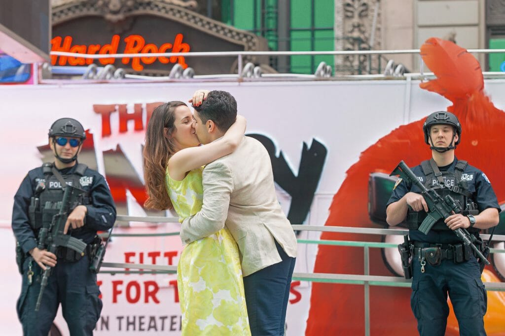 Creative Couple Photography Ideas in NYC at Times Square with Police men as props