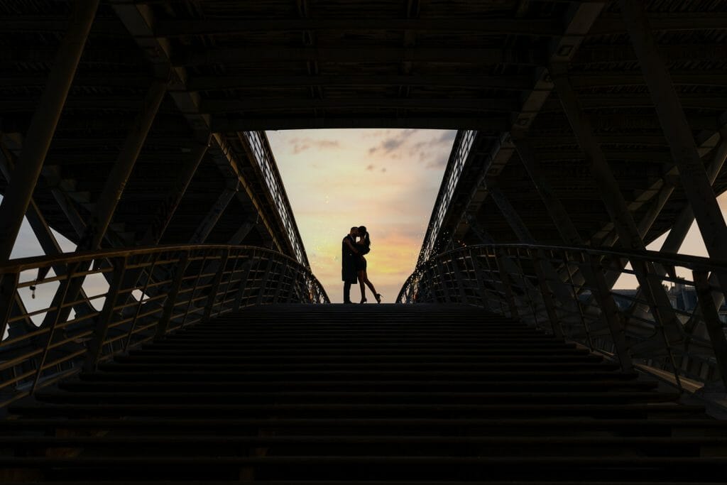 Beautiful engagement photos in Paris near the Louvre Museum with dramatic sky