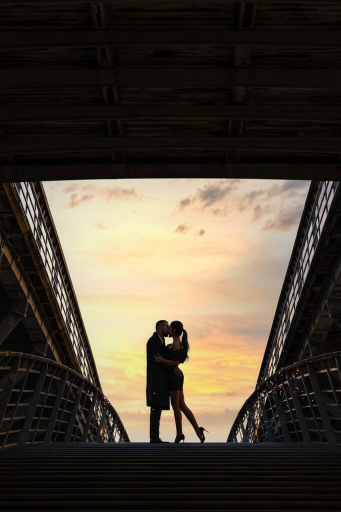 Beautiful engagement photos in Paris near the Louvre Museum with dramatic sky