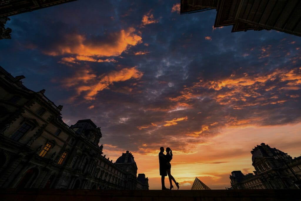 Super Romantic Paris engagement photos at the Louvre Museum during the Blue Hour