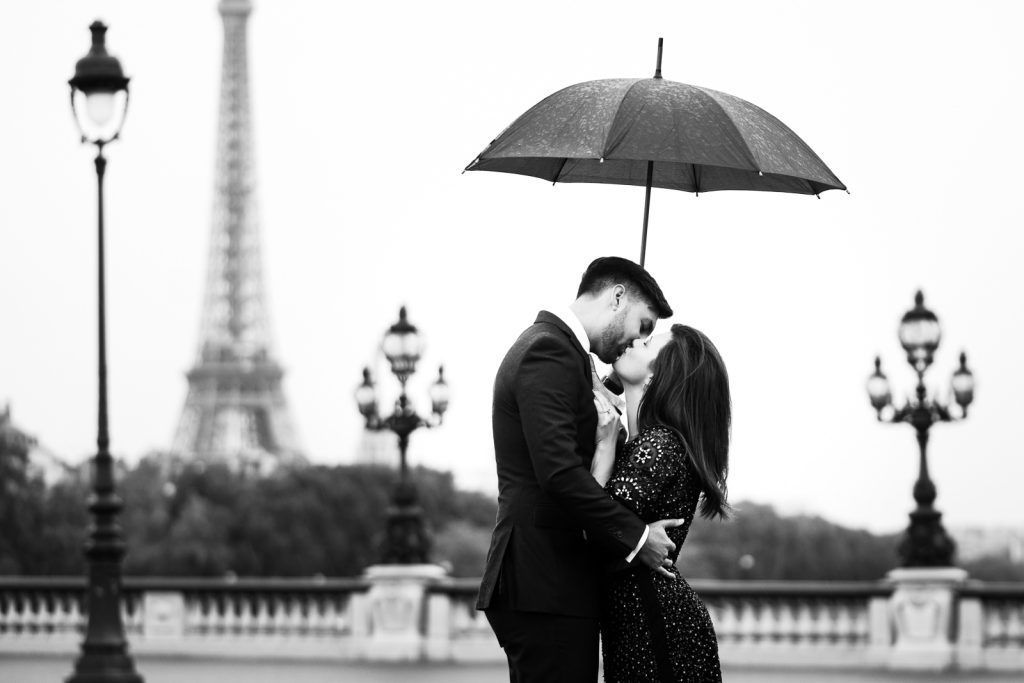 Romantic Eiffel Tower couple pictures in the rain on Alexander IIII Bridge