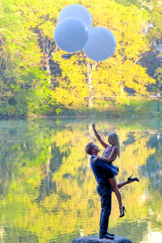 Couple photoshoot poses with oversized balloons Central Park NYC
