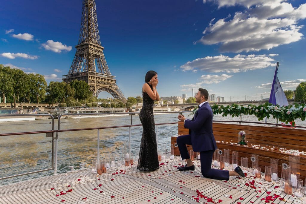 Iconic Eiffel Tower proposal on private Seine River Cruise with rose petals and musicians