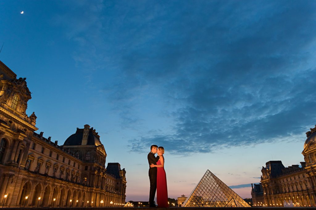 Famous Louvre Couple photo taken at the Pyramid during Blue Hour
