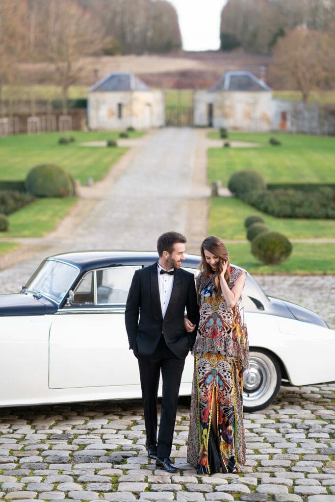 The couple arrives at Chateau de Villette with a vintage Rolls-Royce for their surprise Paris proposal