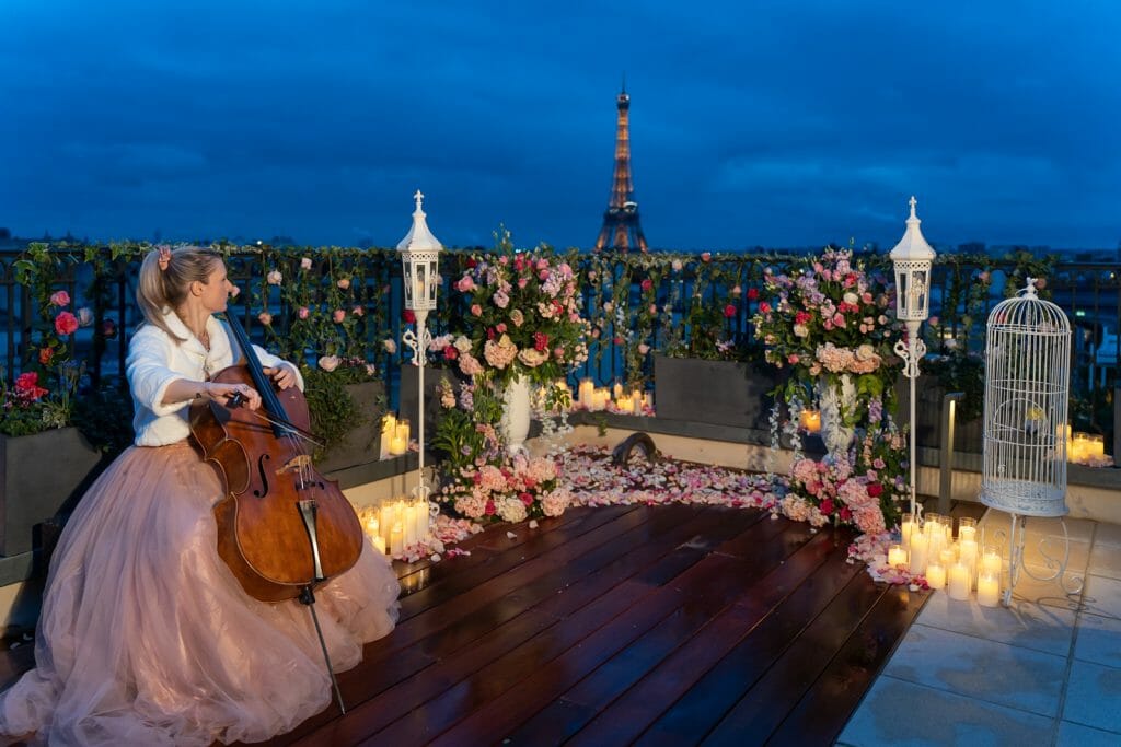 Nighttime rooftop proposal at the Peninsula with cellist