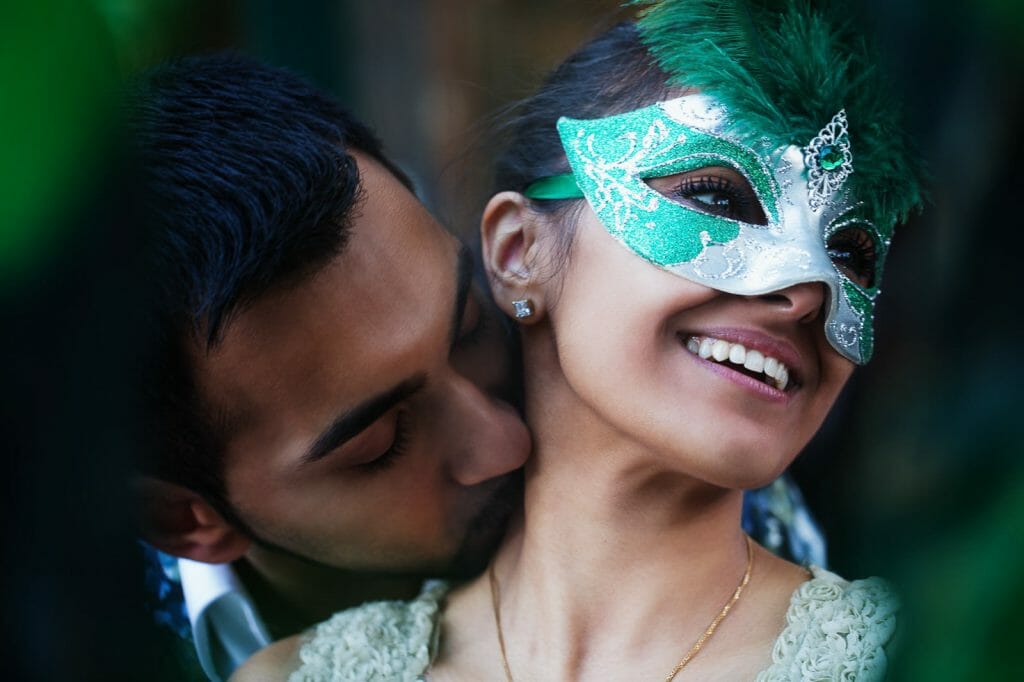 Dreamy Indian engagement photos in Paris with mask as prop
