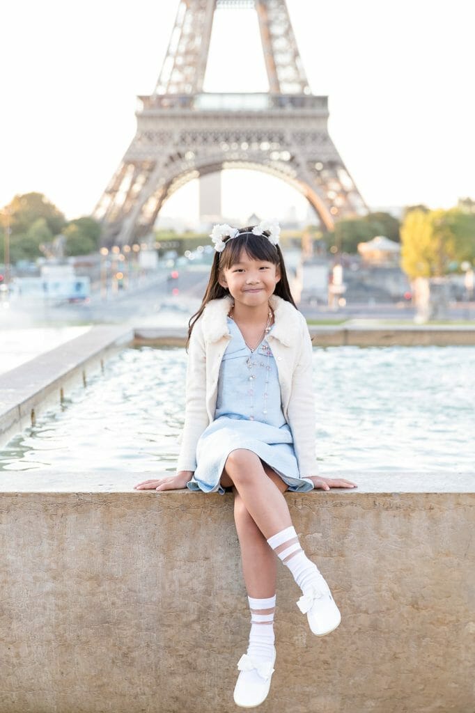 Cute solo portrait in front of the Eiffel Tower at the fountains of Trocadero