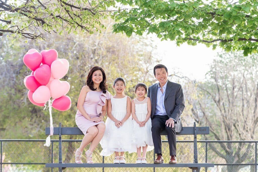 Beautiful Paris family photos Tuileries Gardens with pink balloons