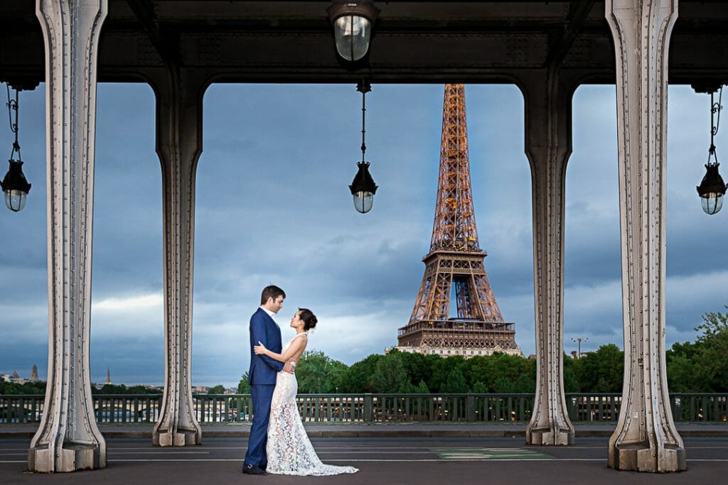paris pre wedding photographer gorgeous Eiffel Tower couple photoshoot at Bir Hakeim Bridge during the Blue Hour