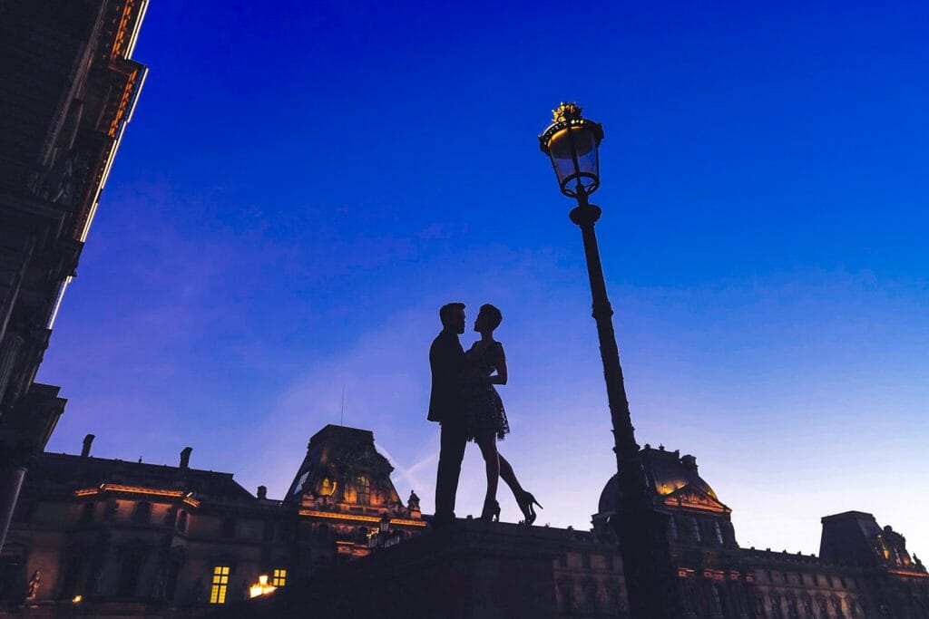 Paris engagement photos at the Louvre Museum during the Blue Hour
