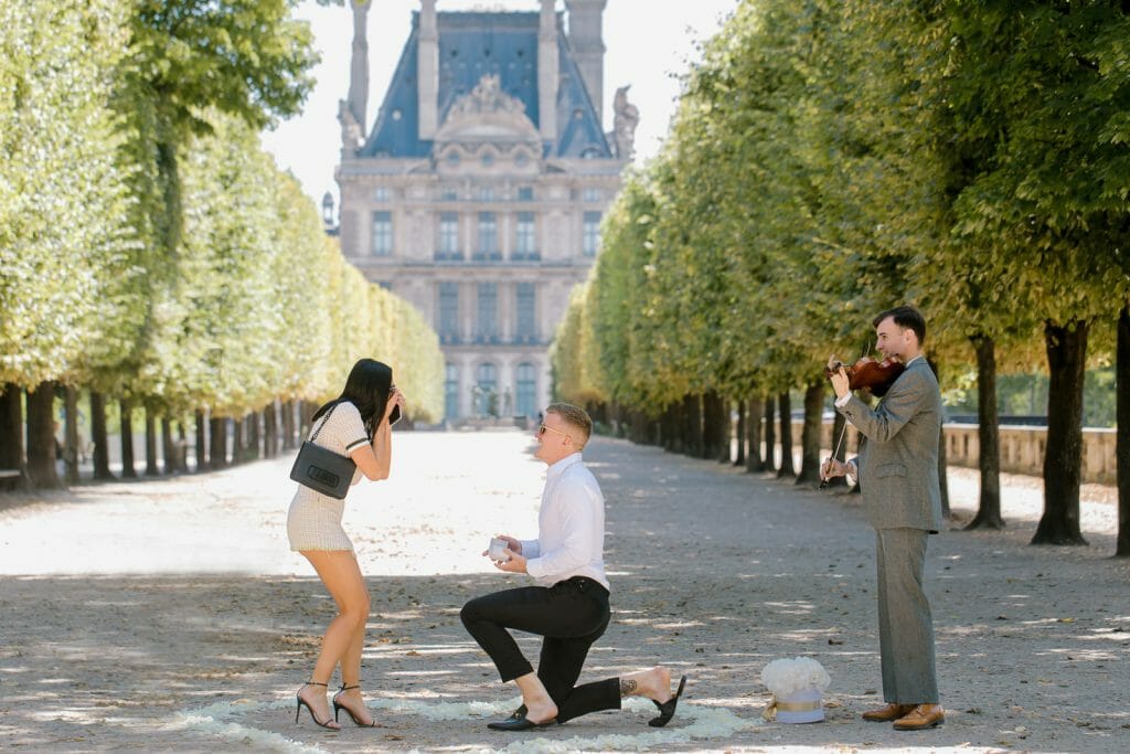 Paris proposal in the Tuileries Garden with the Louvre Museum as backdrop