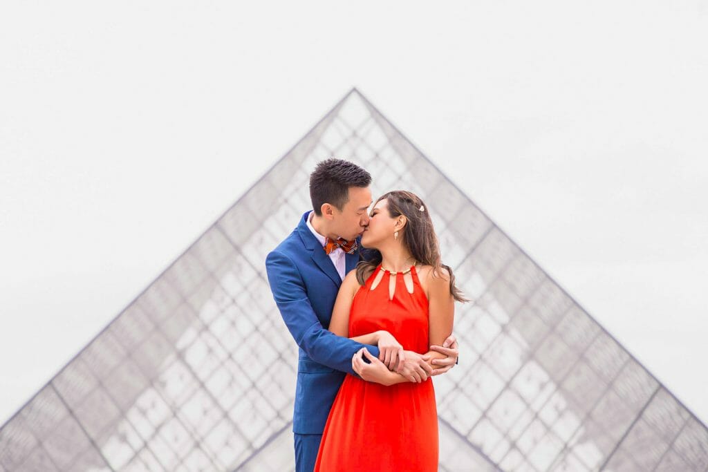Stylish Paris couple photo shoot at the Pyramid of the Louvre Museum