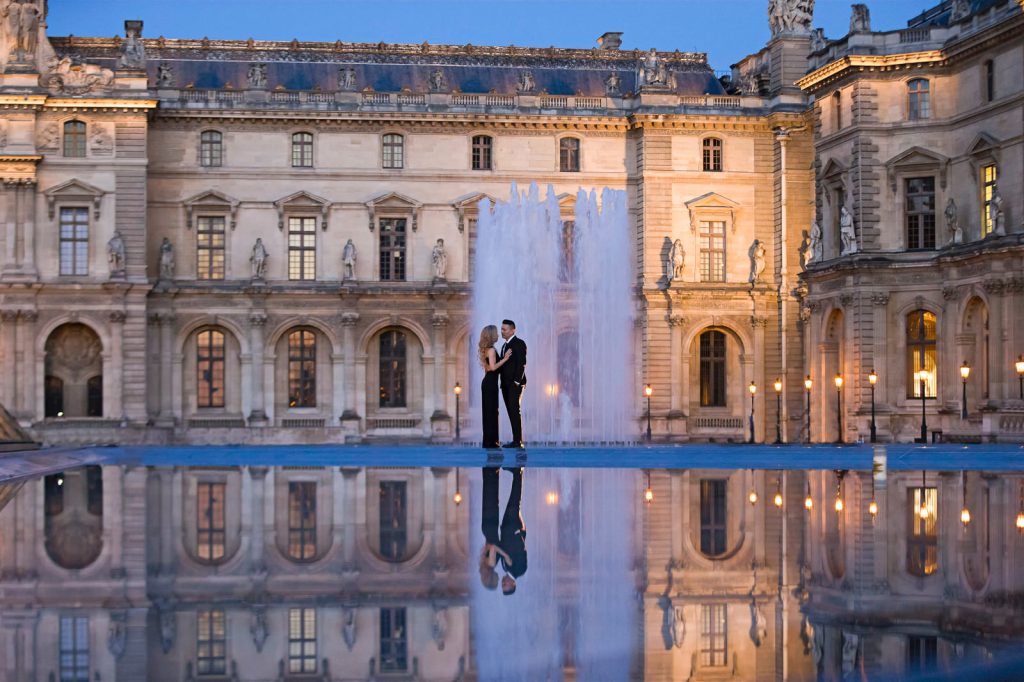 Romantic Paris couple photoshoot at night at the Louvre Museum