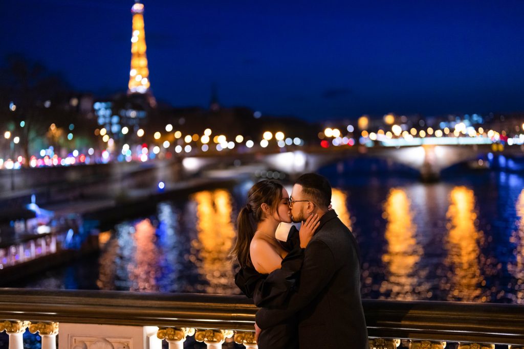 Paris couple photography by night at Alexander III with Eiffel Tower sparkling