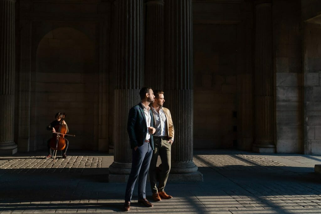 Same-sex Paris engagement photos with musician Louvre Museum