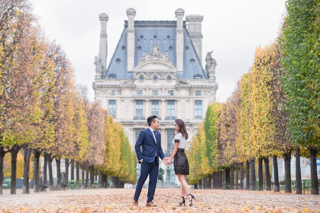 Stylish Paris engagement photos taken in the Tuileries Gardens during the fall season