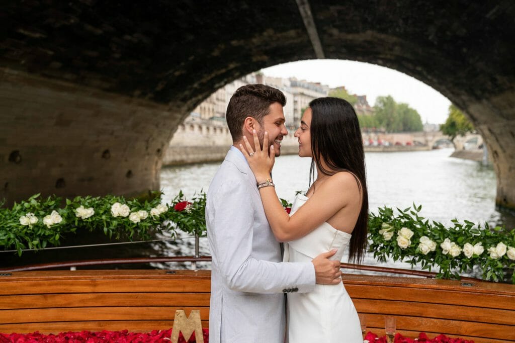 Luxury Paris boat proposal on the Seine with Eiffel Tower as the backdrop
