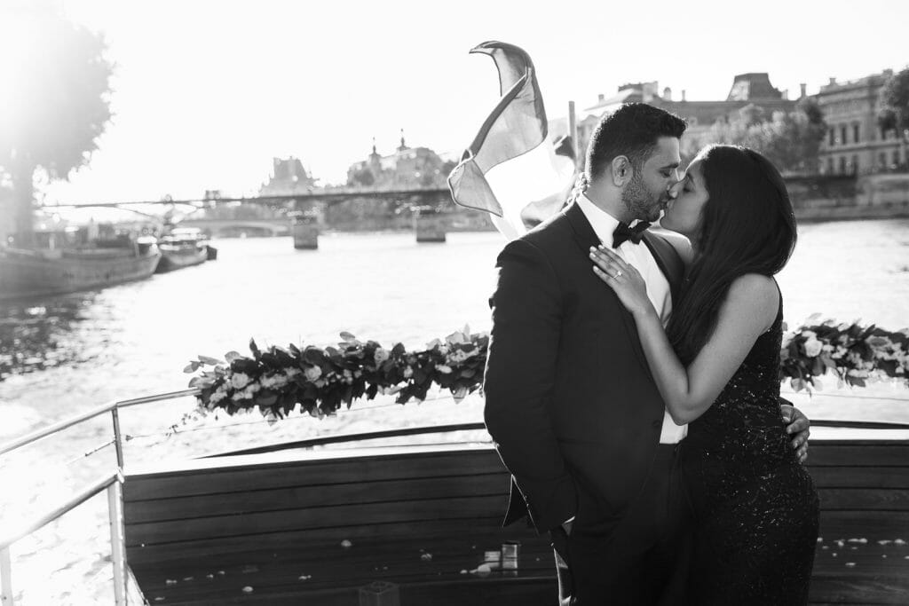 Iconic Eiffel Tower proposal on private Seine River Cruise with rose petals and musicians