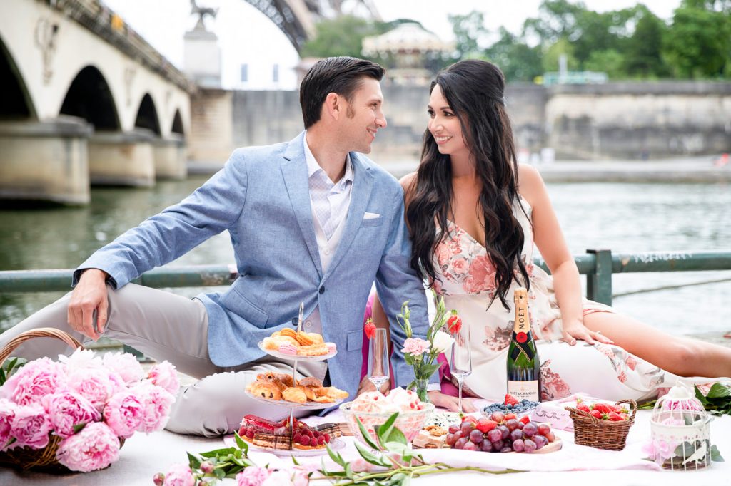 Picnic engagement shoot along the Seine River with Eiffel Tower