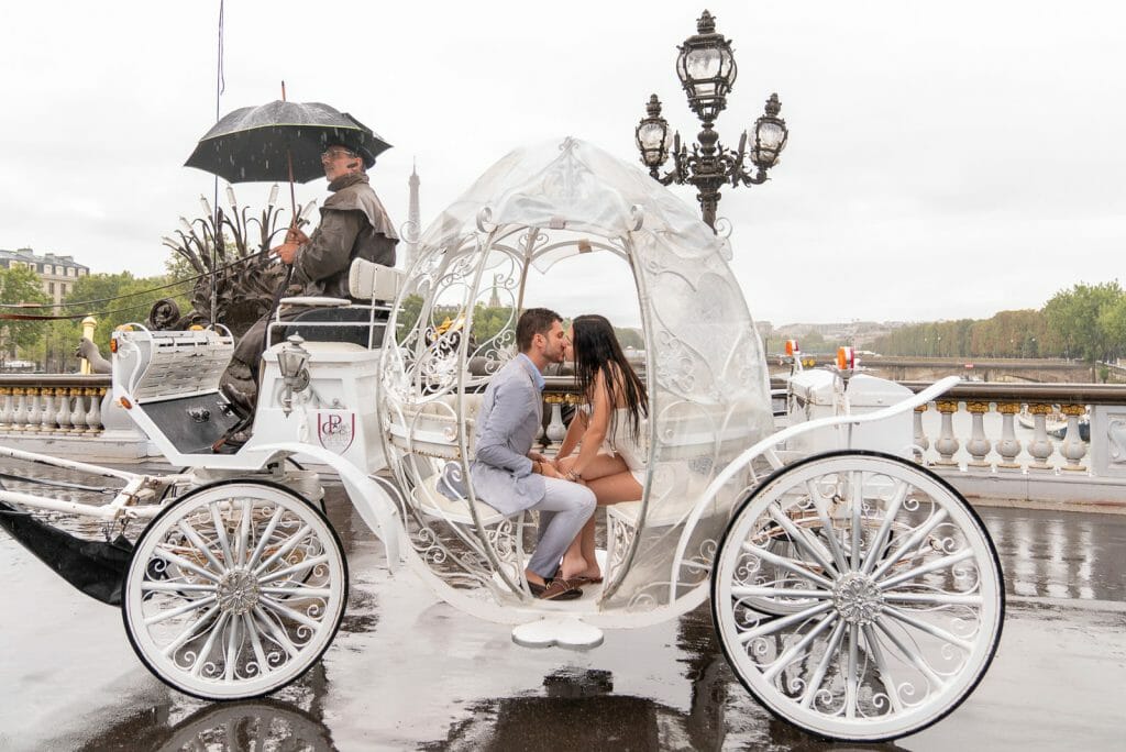Paris proposal ideas with horse carriage on Alexander III Bridge in the rain