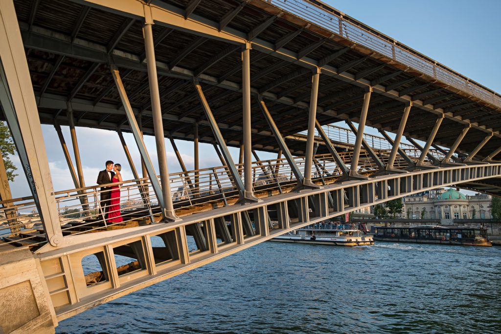Romantic sunset Paris engagement photos on a bridge crossing the River Seine