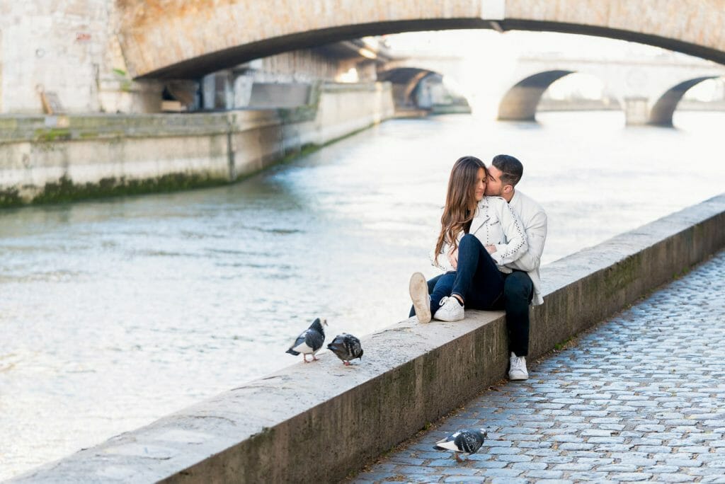 Romantic couple photoshoot along the Seine River near Notre Dame