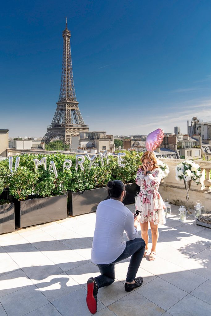Shangri-La exclusive rooftop proposal with Will You Marry Me sign