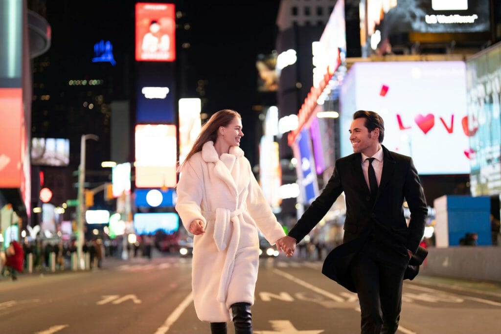 Times Square engagement Photos couple running at night