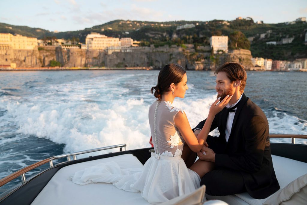 Couple on speedboat Positano Destination Wedding