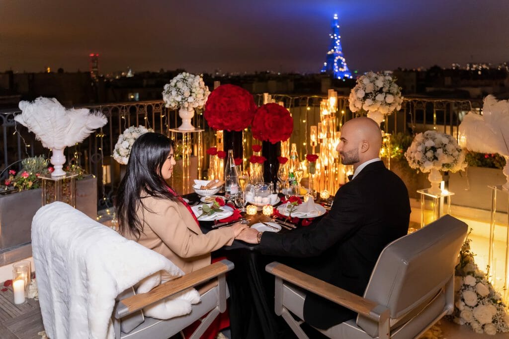 Winter-white Peninsula Hotel Paris Proposal with Eiffel Tower sparkling in Blue