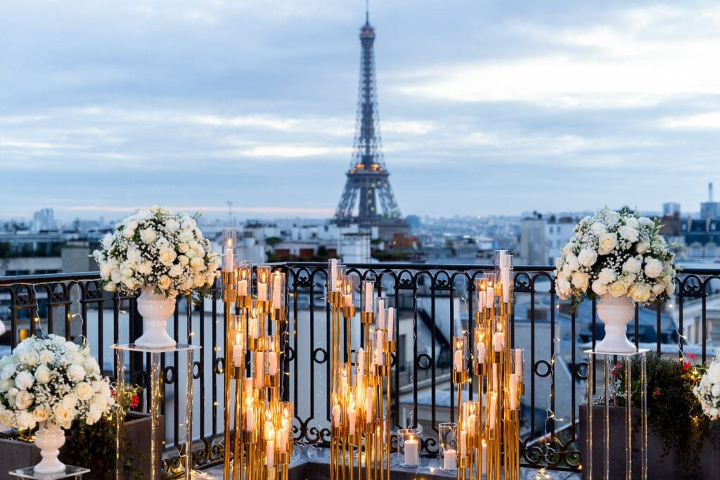 Winter marriage proposal at the Peninsula Hotel Paris with candles and white rose petals