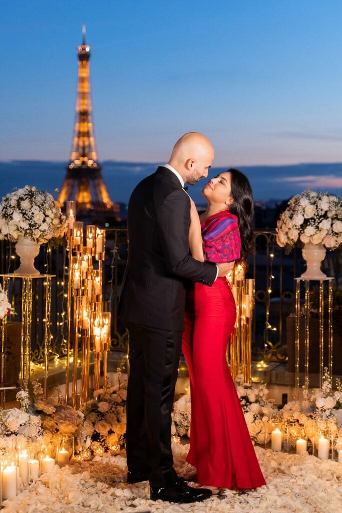 Romantic Peninsula Hotel Paris Proposal with candles, white roses, and musicians