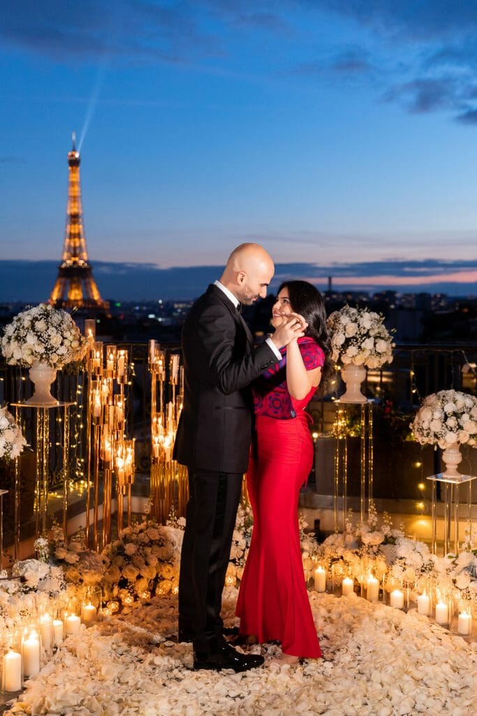 Romantic Peninsula Hotel Paris Proposal with candles, white roses, and musicians