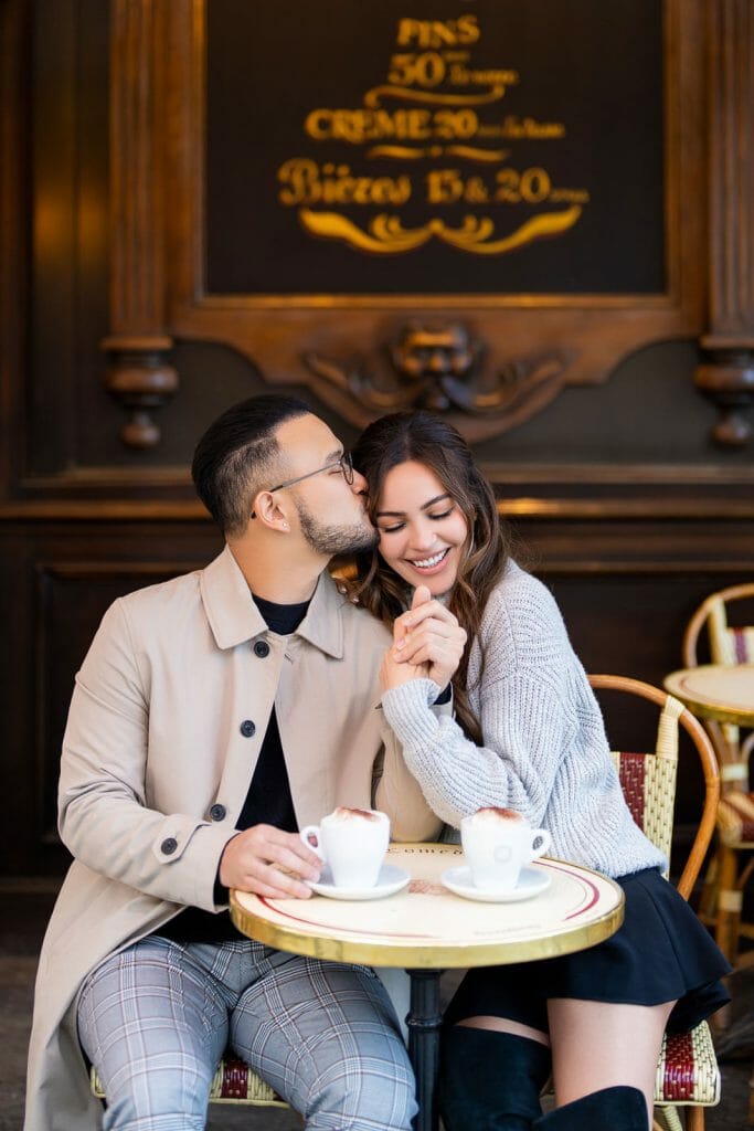 Playful engagement photos in paris at Cafe de la Comedie