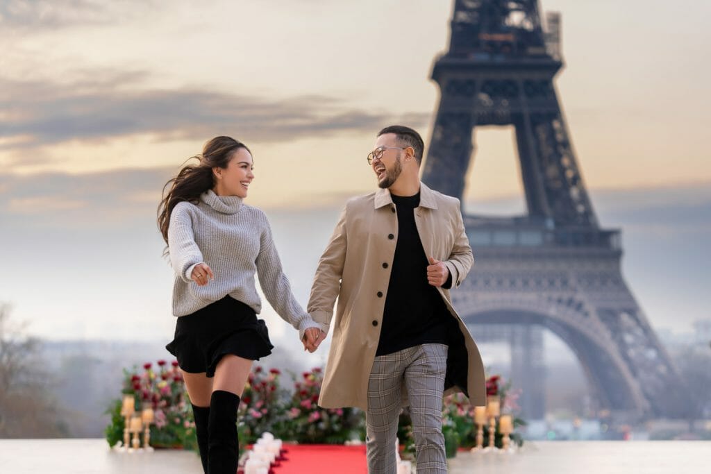 Eiffel Tower engagement photos were taken at sunrise at Trocadero with luxury floral design as a prop