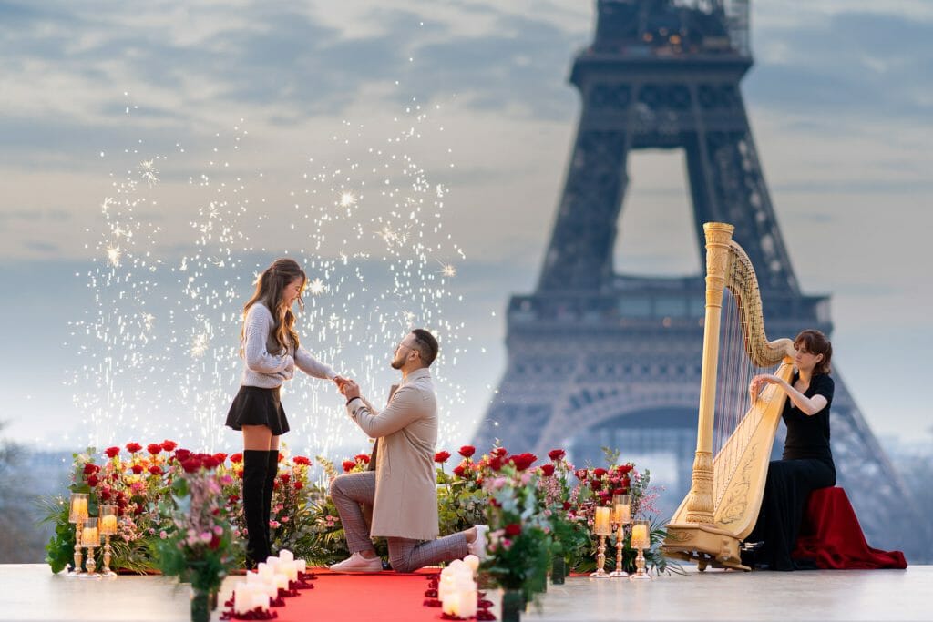 Luxury Eiffel Tower marriage proposal at Trocadero at sunrise with harpist musician and stunning floral design