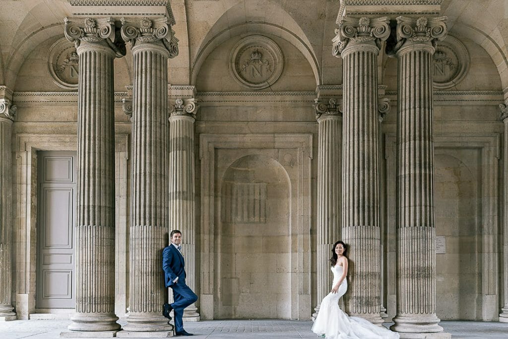 paris pre wedding photographer cute couple photoshoot at the Louvre courtyard