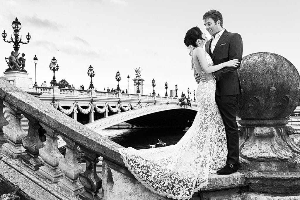 paris pre wedding photographer couple posing at Alexander III Bridge