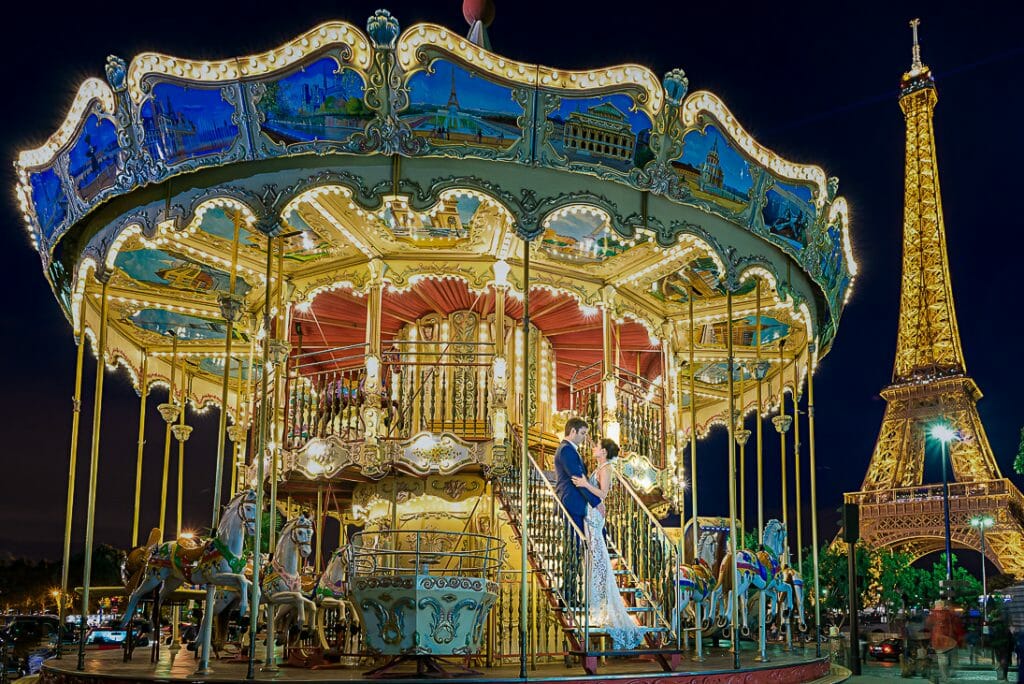 Paris pre wedding photos at the carousel at Trocadero during the Blue Hour with twinkling Eiffel Tower