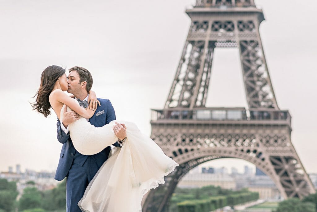 pre wedding photoshoot Eiffel tower beautiful couple photo of groom lifting bride