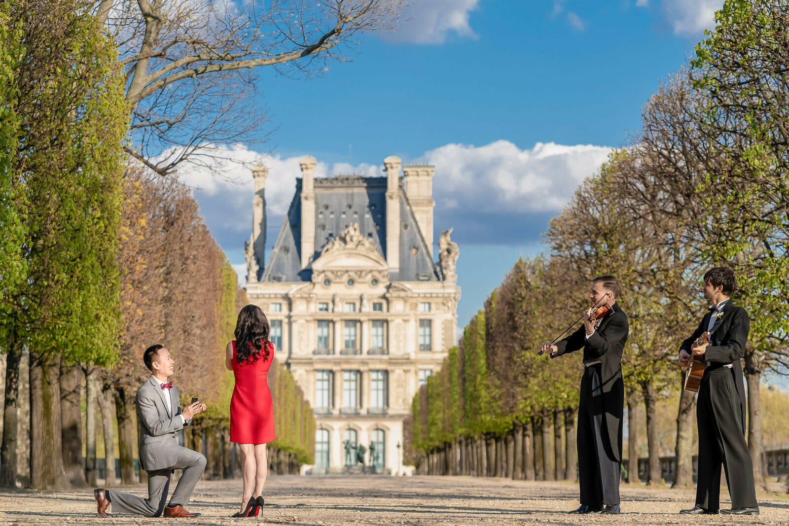 Romantic Tuileries Garden Paris surprise proposal with musicians