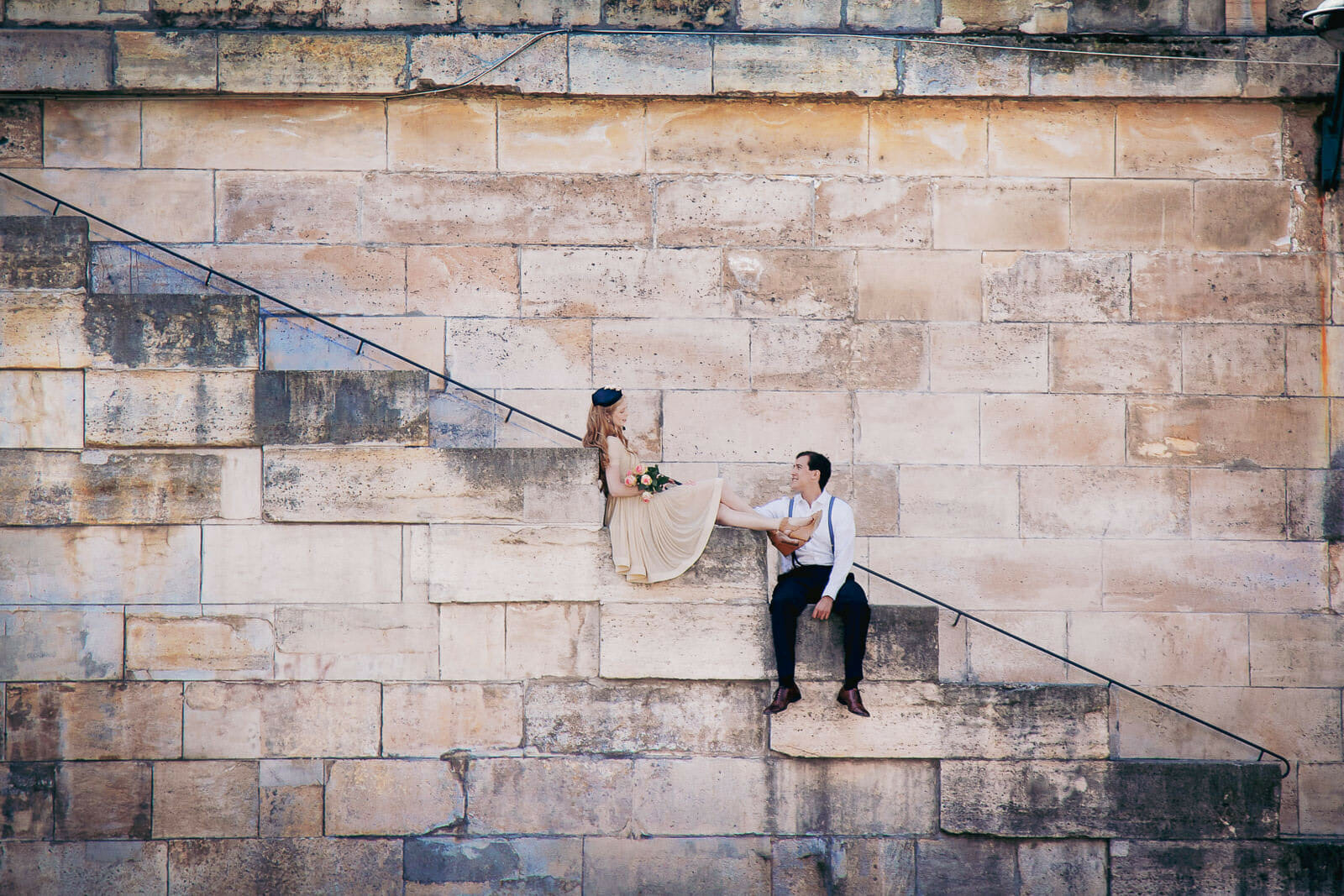 Dreamy couple photoshoot poses in Paris near Notre Dame Cathedral