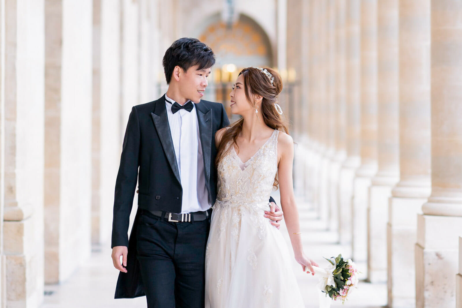 Dreamy pre-wedding Paris photos with flower bouquet at Palais Royal